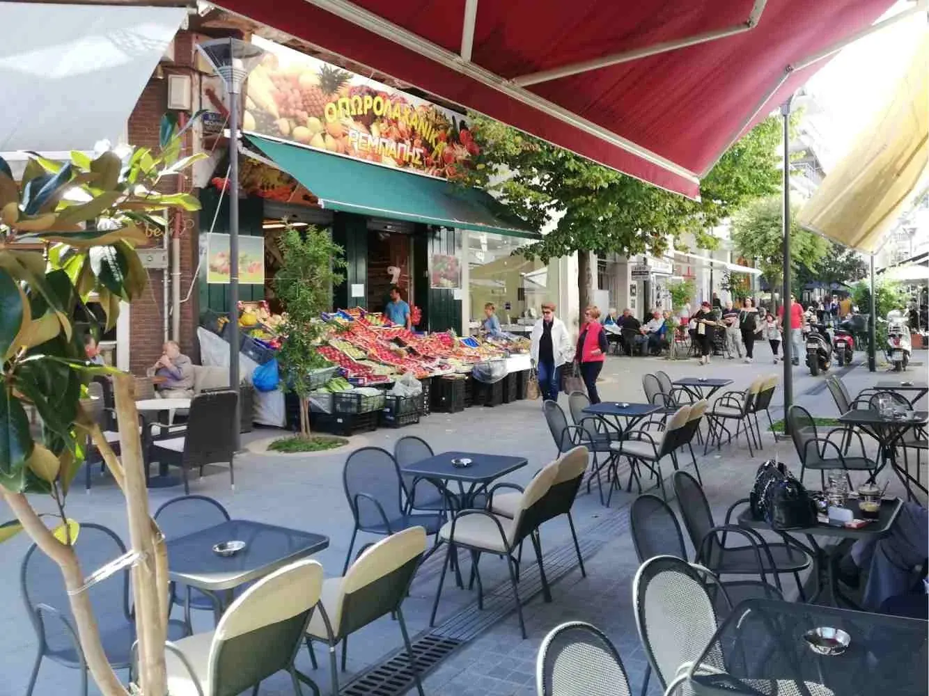 Shops and cafe tables on a pedestrian street in Livadia