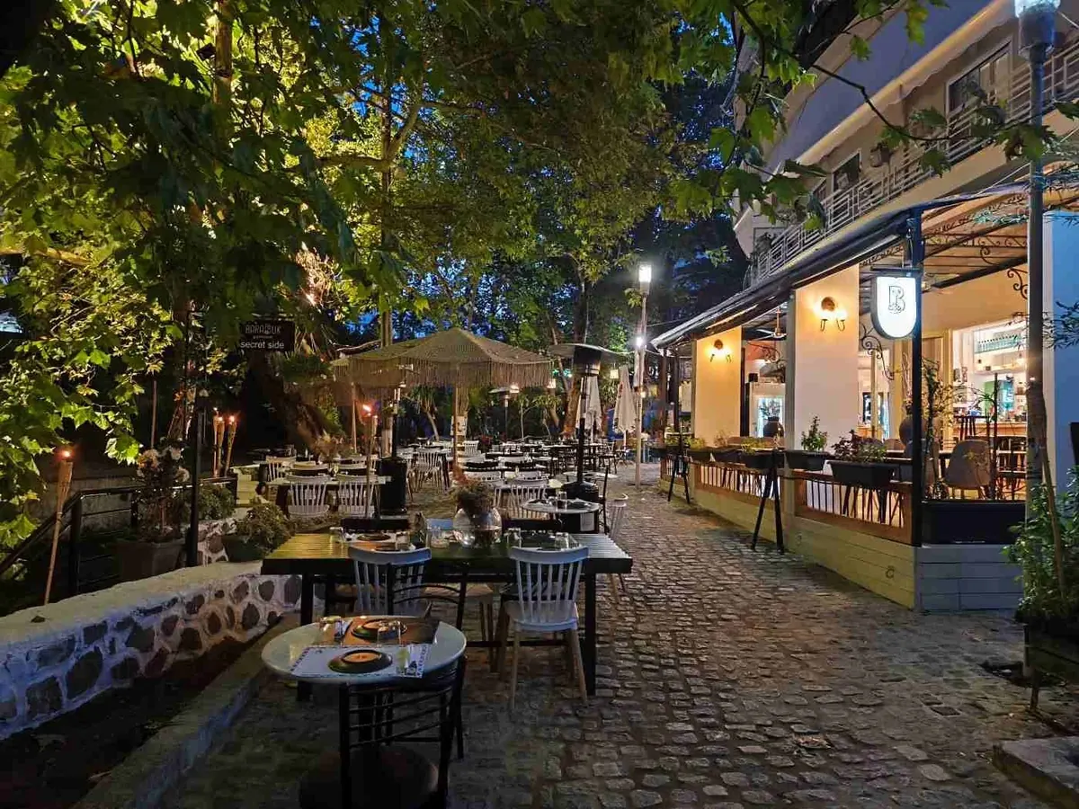 Evening restaurants beside the river in Livadia